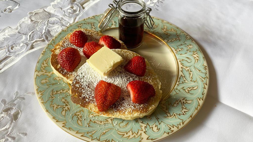 Buttermilk Pancakes with Strawberries · Two pieces. Butter and sugar.