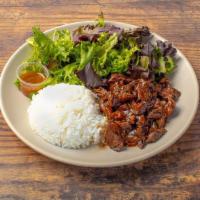 Steak Teriyaki Plate · Grilled grass-fed steak served over white rice, alongside salad, our house-made sesame dress...