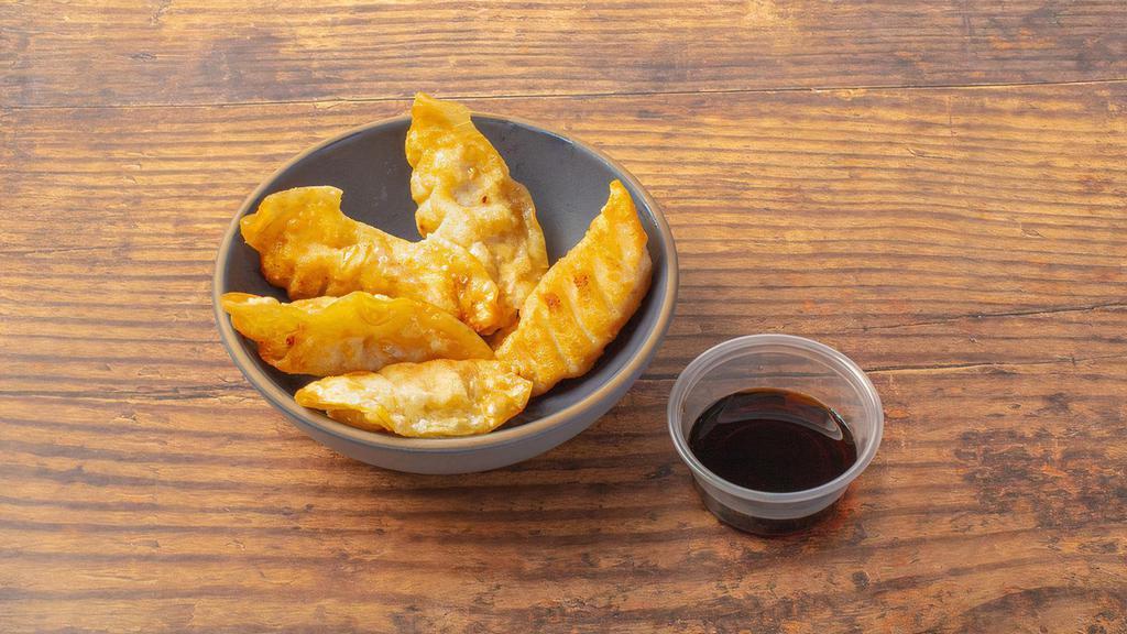 Pork Gyoza · Crispy dumplings filled with minced pork. Served with our gyoza dipping sauce. Contains gluten, soy, nightshades, and eggs. We cannot make substitutions.