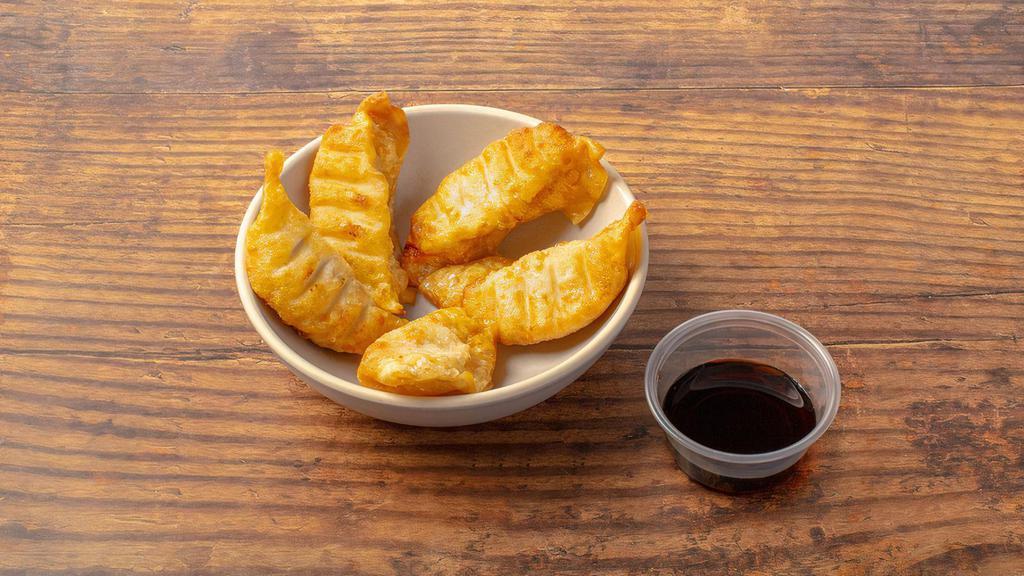 Chicken Gyoza · Crispy dumplings filled with minced chicken. Served with our gyoza dipping sauce. Contains gluten and soy. We cannot make substitutions.