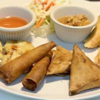 11. Combo Appetizers · 2 pieces each of pork spring rolls, chicken satay, prawn rolls and Thai samosas.