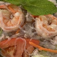 35. Silver Noodle Salad · Silver noodle, prawns, ground chicken; tossed with mint leaves, red onion, carrot, cilantro,...
