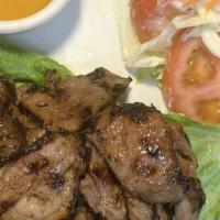 41. Grilled Pork · Grilled marinated pork with special garlic sauce; served with fresh green salad.