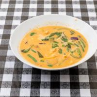 52. Red Curry · In coconut milk with eggplant, bamboo shoot, bell pepper and sweet basil.