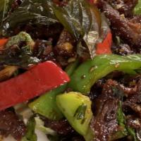 78. Spicy Crispy Duck · Sautéed crispy roasted duck with chili oil paste, garlic sauce, bell pepper and crispy basil.