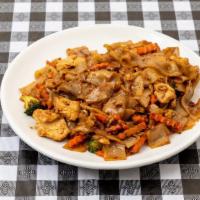 82. Pad Kee Mao · Stir-fried flat rice noodle with chili, onion, green bean, bell pepper, tomato, bean sprout ...