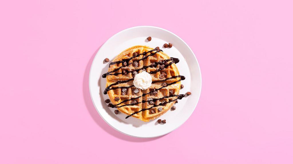 Chocolate Chip Waffle · A fluffy Belgian waffle dotted with delicious chocolate chips and topped with maple syrup and whipped cream.