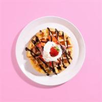 Strawberry Chocolate Waffle · A fluffy Belgian waffle drizzled with chocolate sauce and topped with strawberries, maple sy...