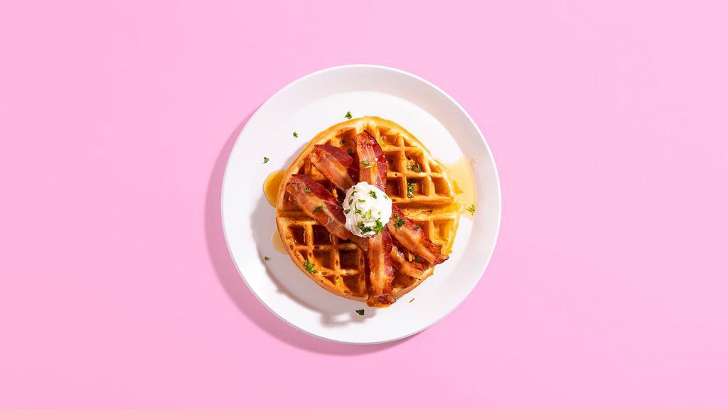 Maple Bacon Waffle · A fluffy Belgian waffed topped with crispy bacon and maple syrup.