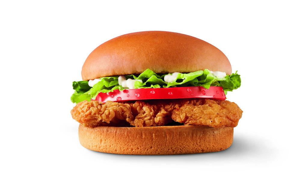 Crispy Chicken Sandwich · A crispy chicken fillet topped with crisp chopped lettuce, thick-cut tomato, and mayo on a warm toasted bun.