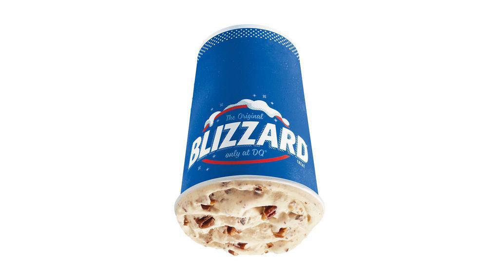 Turtle Pecan Cluster Blizzard® Treat · Pecan pieces blended with chocolate, rich caramel and creamy vanilla soft serve.