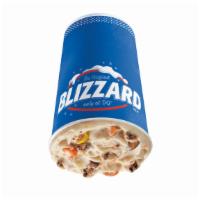 Reese'S Pieces Cookie Dough Blizzard® Treat · REESE'S PIECES, chocolate chip cookie dough and peanut butter topping blended with our world...