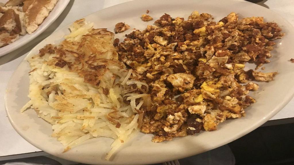 Chorizo · Chorizo scrambled with 2 ranch eggs served with golden hashbrown with toast & jelly or tortilla.