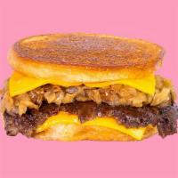 Karl'S Deluxe · A patty melt served Karl’s Style with a crispy seasoned beef patty, caramelized onion & chee...