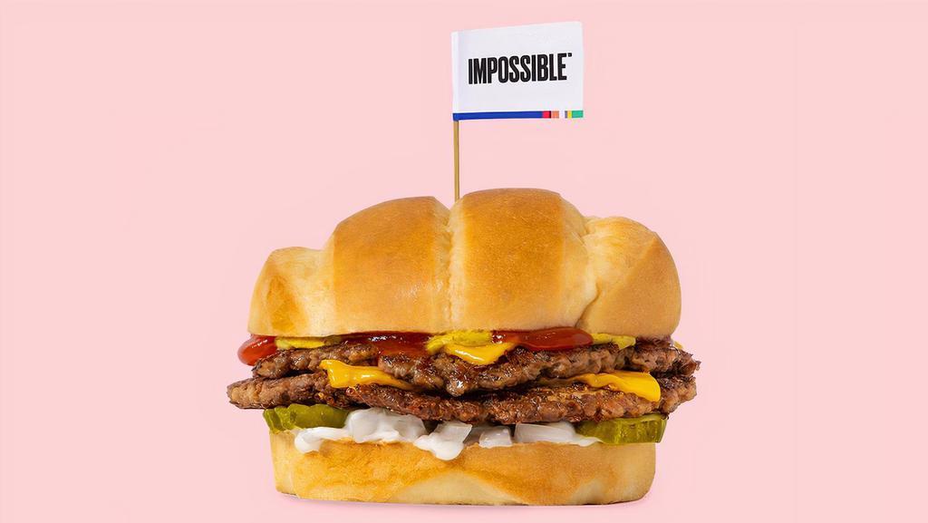 Impossible™️ Beast Style · Smashed crispy Impossible™ patties with house seasoning, American cheese, pickles, diced white onion, mayo, ketchup, and brown mustard on a soft roll.