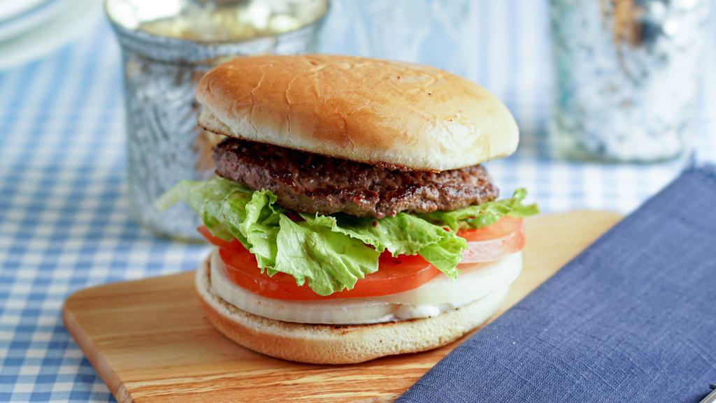 Hamburger · A 1/3 lb. all beef patty served on a toasted bun with tomatoes, lettuce, onions and dressing.