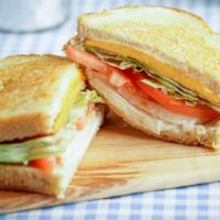 Grilled Cheese · Grilled choice of bread with three thick slices of cheese. Served with everything (tomatoes,...
