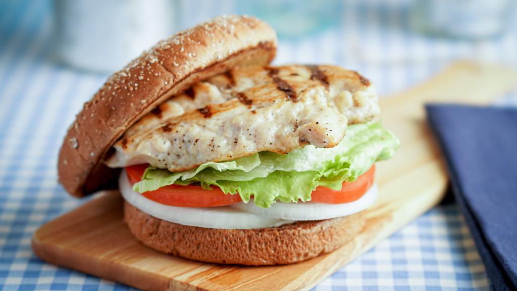 Grilled Chicken · Grilled chicken breast served on a toasted whole wheat bun with tomatoes, lettuce, onions and dressing.
