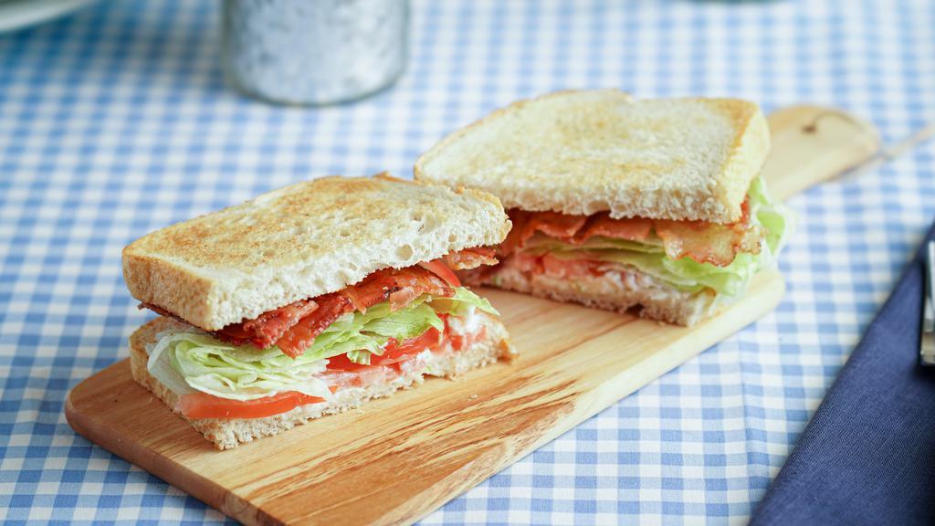 Bacon, Lettuce and Tomato · Toasted choice of bread served with 4 thick slices of bacon, lettuce, tomatoes, and dressing.