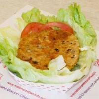 Lettuce Harvester Wrap · No bun. Harvester patty with tomatoes, onions and dressing. Served wrapped in lettuce.