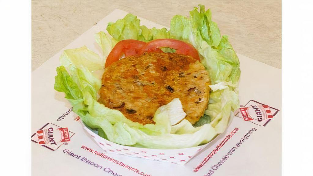 Lettuce Harvester Wrap · No bun. Harvester patty with tomatoes, onions and dressing. Served wrapped in lettuce.