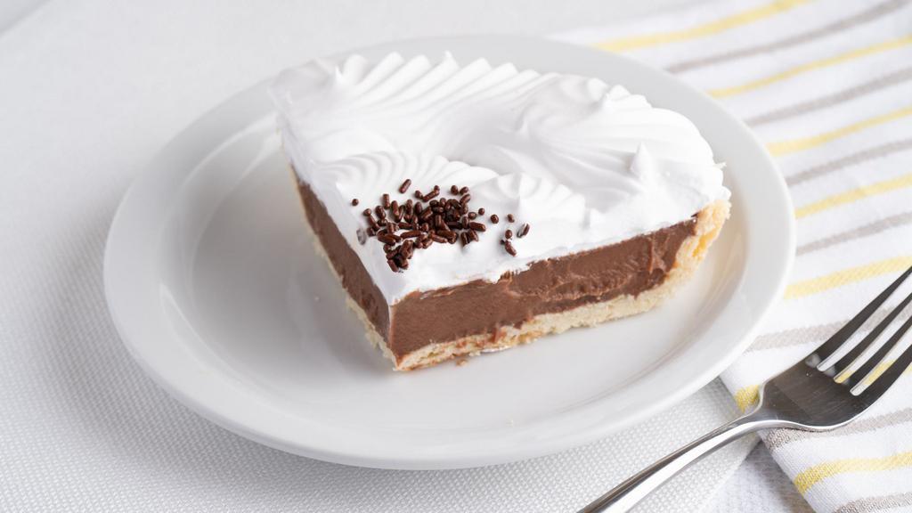 Chocolate Crème (Slice) · Guittard chocolate bars melted with cream inside a flakey pie crust. Topped with whipped topping.