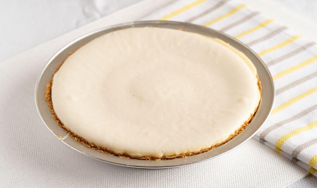 Cheesecake Pie Plain (Whole) · A cheesecake pie made with real Philadelphia cream cheese in hand pressed graham cracker crust.