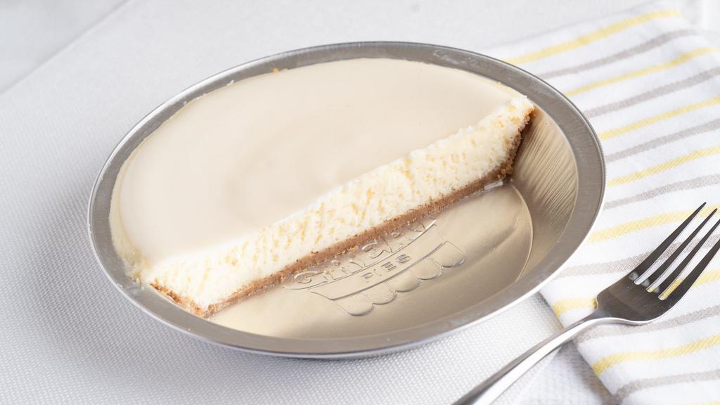 Cheesecake Pie Plain (Half) · A cheesecake pie made with real Philadelphia cream cheese in hand pressed graham cracker crust.