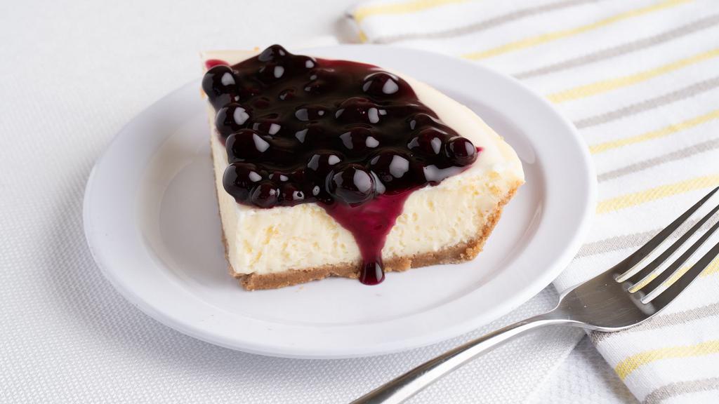 Cheesecake with Blueberry Topping (Slice) · A cheesecake pie   made with real Philadelphia cream cheese in hand pressed graham cracker crust, topped with blueberry compote.