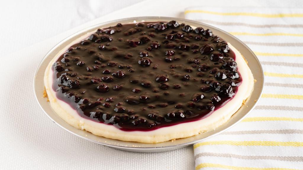 Cheesecake with Blueberry Topping (Whole) · A cheesecake pie   made with real Philadelphia cream cheese in hand pressed graham cracker crust, topped with blueberry compote.