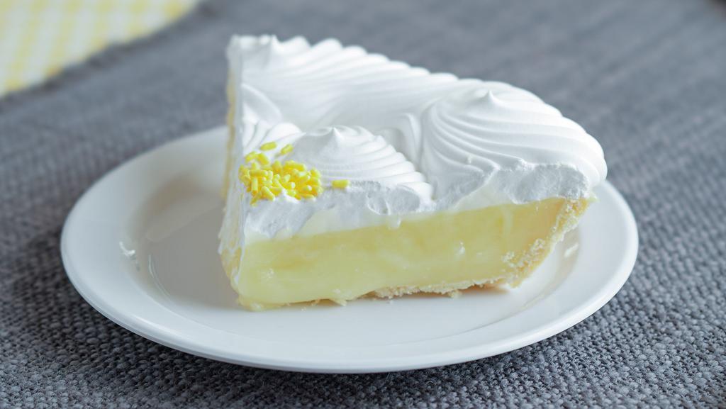 Lemon Cream (Slice) · A tart lemon filling inside a flakey pie crust. Topped with whipped topping.