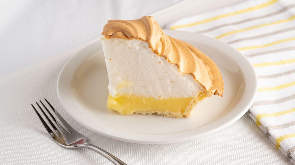 Lemon Meringue (Slice) · Hand topped and spun meringue on a tart lemon filling inside a flakey pie crust.