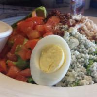 Cobb Salad · Turkey breast, bacon, hard-boiled egg, tomatoes, blue cheese, and avocado.