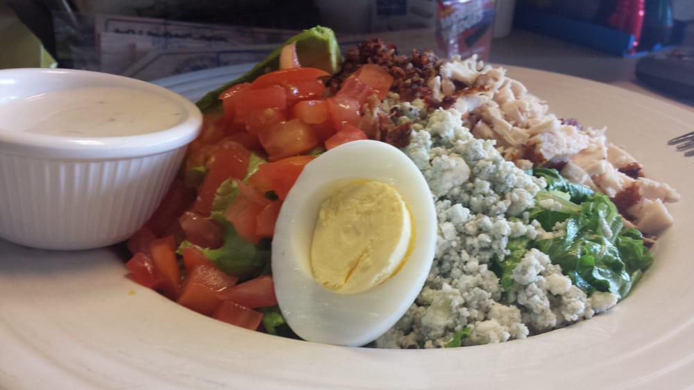 Cobb Salad · Turkey breast, bacon, hard-boiled egg, tomatoes, blue cheese, and avocado.