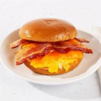 Bacon Egg And Cheese Breakfast Sandwich · Two eggs with melted cheese, crisp bacon on your choice of bread.