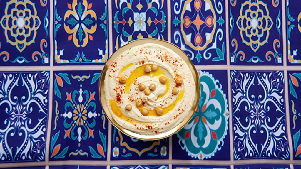 Hummus · Classic chickpea puree with tahini, lemon, and garlic.