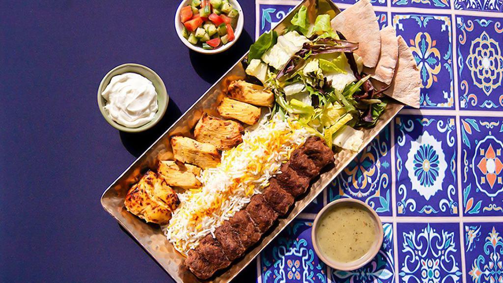 Crown-Worthy Combo Rice Platter · Tender charbroiled chicken skewers and flavorful beef patties, over saffron rice and served with greek salad, tzatziki, and pita.