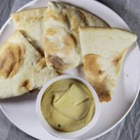 Hummus · Gluten free, vegetarian. Puree of garbanzo beans with olive oil, lemon juice, tahini oil and...