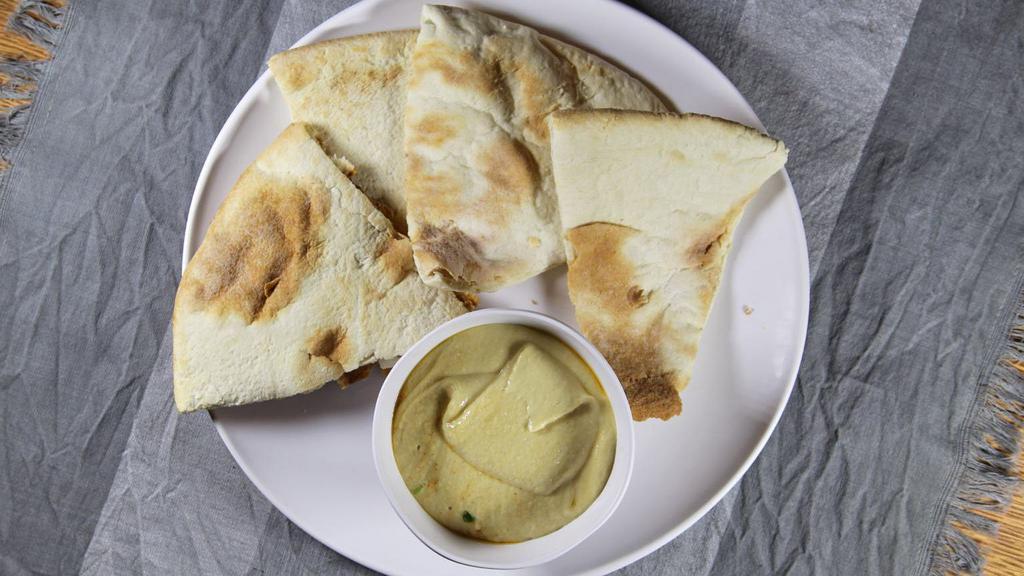 Hummus · Gluten free, vegetarian. Puree of garbanzo beans with olive oil, lemon juice, tahini oil and spice.