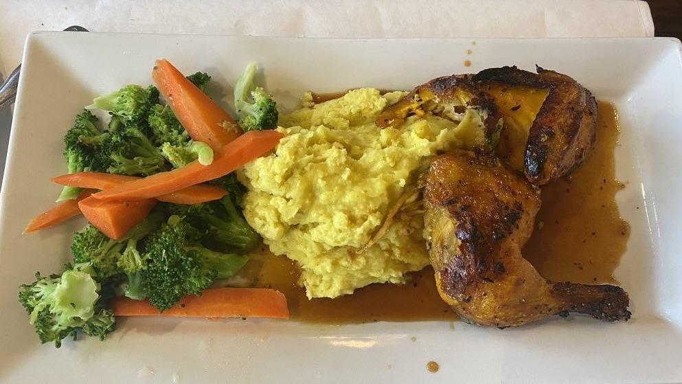 Pomegranate Chicken · Marinated roasted chicken infused with pomegranate sauce served with roasted garlic mashed potato and fresh vegetables.