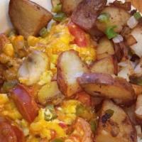 Spicy Scramble · Linguica, onion, bell pepper, corn salsa, mushrooms, Cheddar, and spicy sauce.