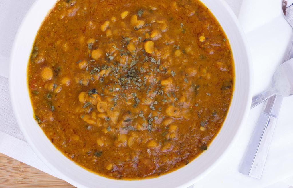 Dal Tarka · Vegan, gluten-free. Organic yellow lentils cooked with tomatoes, onions, ginger, and green chili.