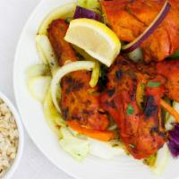 Tandoori Chicken (Half) · Gluten-free. Two whole chicken legs marinated in a traditional style yogurt and spice sauce ...
