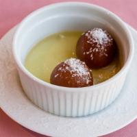 Gulab Jamun · Juicy light pastry made from milk, served with hot honey syrup.