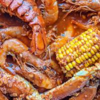 Yo Mama's Combo: Lobster tail, Snow crab, 1lb Shrimp, 4 corn, 4 sausages · 4oz Lobster tail, Snow crab, 1lb Shrimp, 4 corn, 4 sausages