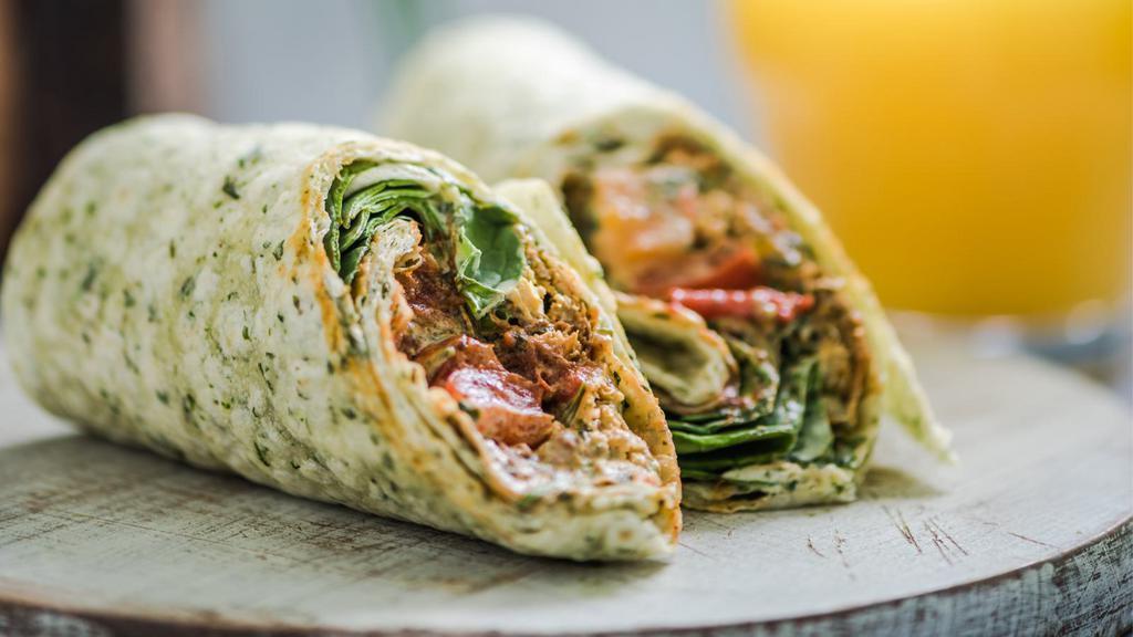Grilled Fajita Burrito · Flavorful fajita burrito filled with your choice of meat and rice. Packed with a house fajita mix, pinto beans, guacamole, and cheese in a tomato tortilla.