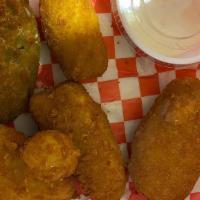 Jalapeño Popper · Juicy jalapeno poppers breaded and filled with cheese and fried to golden perfection.