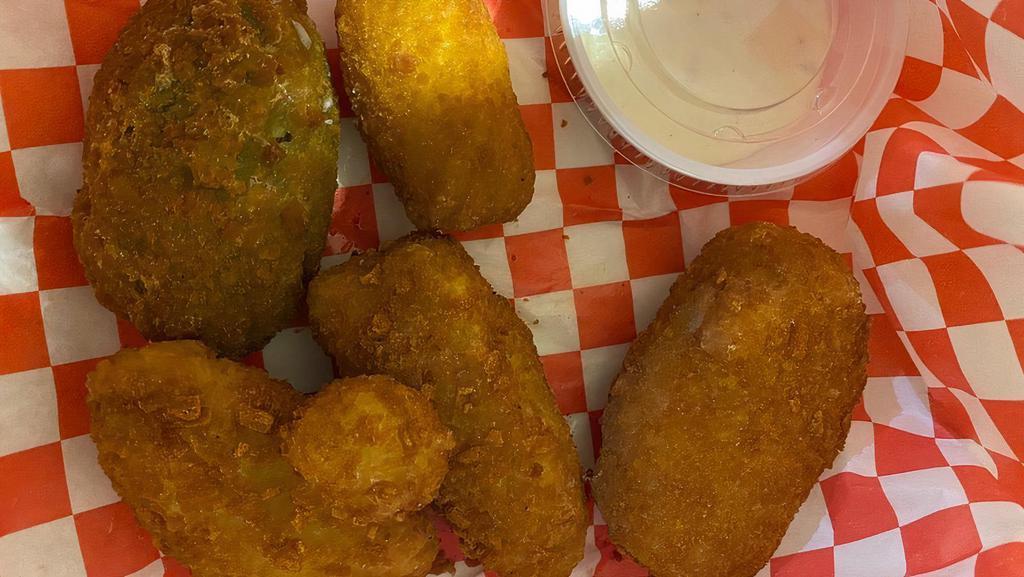 Jalapeño Popper · Juicy jalapeno poppers breaded and filled with cheese and fried to golden perfection.