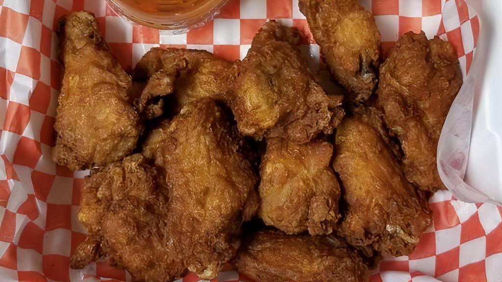 Bone-In Wings · Deep-fried chicken wings with your choice of sauce.