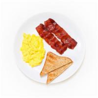 Farm Eggs · Two farm eggs scrambled and served with whole wheat toast and two strips of crispy turkey ba...